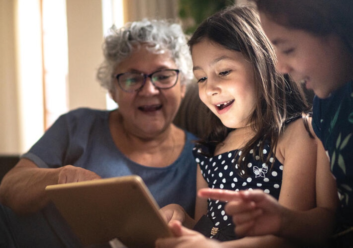 Multi-generational family reading together