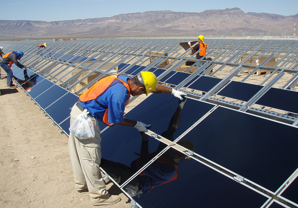 Sempra team members construct the company's first solar panel field on Copper Mountain in Boulder City, Nevada
