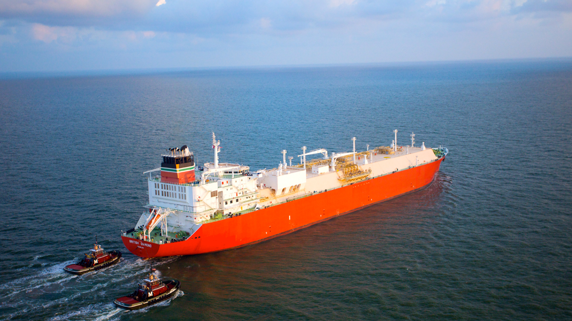 An LNG tanker ship cruises across the open ocean