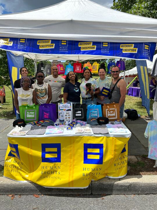 Human Rights Campaign team members at an event booth