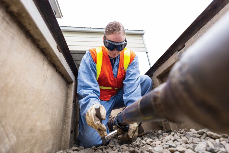 An employee works in the field.