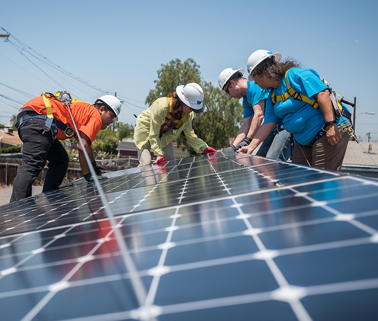 SDG&E team members install solar panels