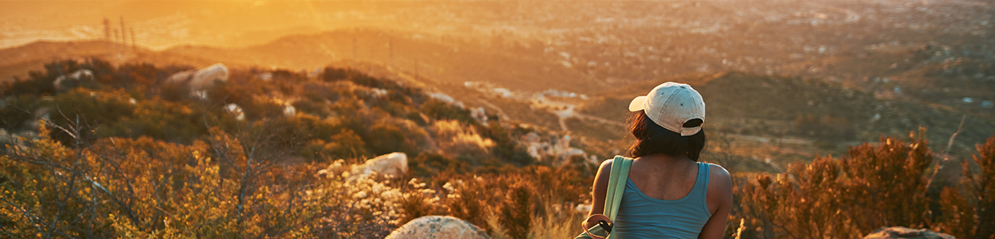 woman sitting at sunset with view of mountain woman sitting at sunset with view of mountain