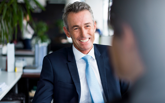 A potential investor sitting at a desk